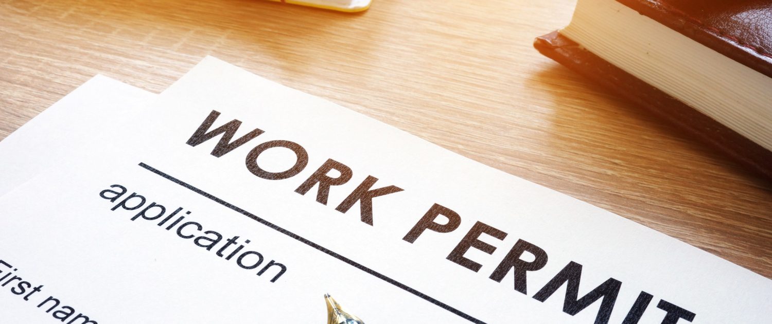 Work permit application on a table.